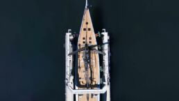 Aerial view of yacht docked at pier. WallyWind110