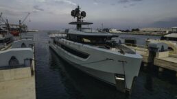 Alia Yachts Sea Club 53. Large yacht docked at marina during twilight.