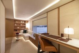 Seawolf X Yacht Interior Rossinavi. Luxurious yacht interior with desk and seating area.