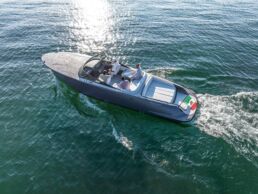 Luxury boat on open water with passengers. Maserati Tridente Full-Electric Boat