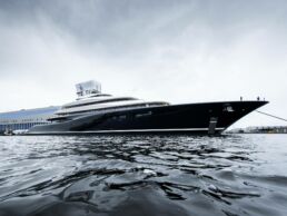 Luxury hydrogen fuel cell yacht docked at shipyard.