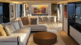 Luxurious modern yacht interior with sofa and dining. Navetta 38 Motor Yacht