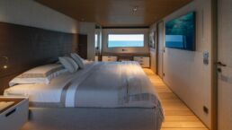 Luxury motor yacht bedroom with ocean view. Navetta 38 Motor Yacht