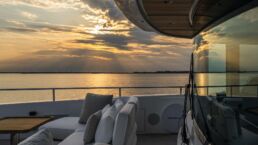 Luxurious yacht deck at sunset over sea. Navetta 38 Motor Yacht