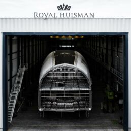 Royal Huisman yacht in construction shed.