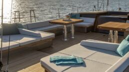 Luxury yacht deck at sunset.