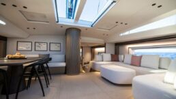 Modern yacht interior with skylight, seating, and dining table. Sailing Yacht GELLICEAUX Southern Wind