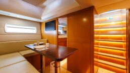 Luxury yacht interior dining area and staircase lighting. YYachts Y9 Sailing Yacht