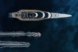 140m Trimaran Motor Yacht Spear. Aerial view of luxury yacht and speedboats in ocean.