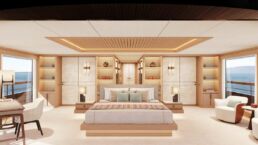 Luxury yacht bedroom with ocean view and modern decor.