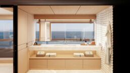 Modern luxury yacht bathroom with ocean view and wooden decor