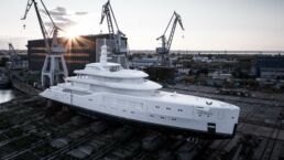 Amels 80 Motor Yacht. ,Large yacht in shipyard at sunset