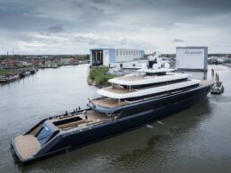 Feadship Project 1012 Superyacht. Luxury yacht at shipyard dock.