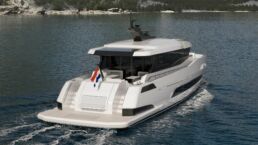 Holterman X-65 20m Motor Yacht. Modern yacht cruising on scenic lake.