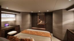 Holterman X-65 20m Motor Yacht Interior. Modern bedroom with desk and laptop.