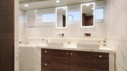 Holterman X-65 20m Motor Yacht Interior. Modern bathroom with marble accents and double sinks.