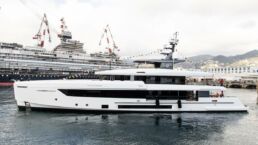 Luxury yacht docked at shipyard with cranes. Motor Yacht GO Tankoa Yachts