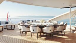 Elegant dining table on yacht deck with sea view