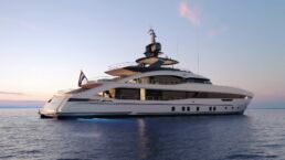 Luxury yacht at sunset on the ocean.