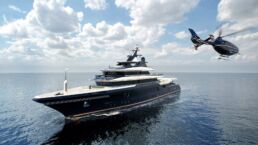 Luxury yacht with helicopter on ocean