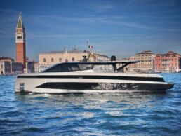 WallyWhy100 Motor Yacht. Modern yacht near historic Venice buildings