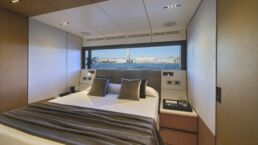 WallyWhy100 Motor Yacht. Luxurious bedroom with ocean view window