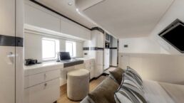 Zeelander 5 Modern yacht bedroom with desk and window.