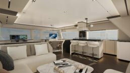 Luxury yacht interior with modern kitchen and lounge.