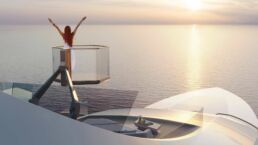 Feadship Concept C. Woman enjoying sunset on yacht deck.