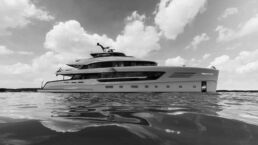 Triple X Vripack Yacht Design. Luxury yacht on calm sea under cloudy sky