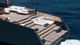 SAN Motor Yacht ALIA Yachts. Luxury yacht deck with seating on ocean