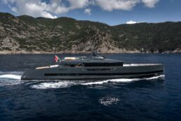 SAN Motor Yacht ALIA Yachts. Luxury yacht cruising near scenic coastline