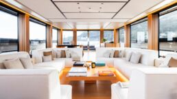 SAN Yacht Interior. Luxury yacht interior with white sofas and windows